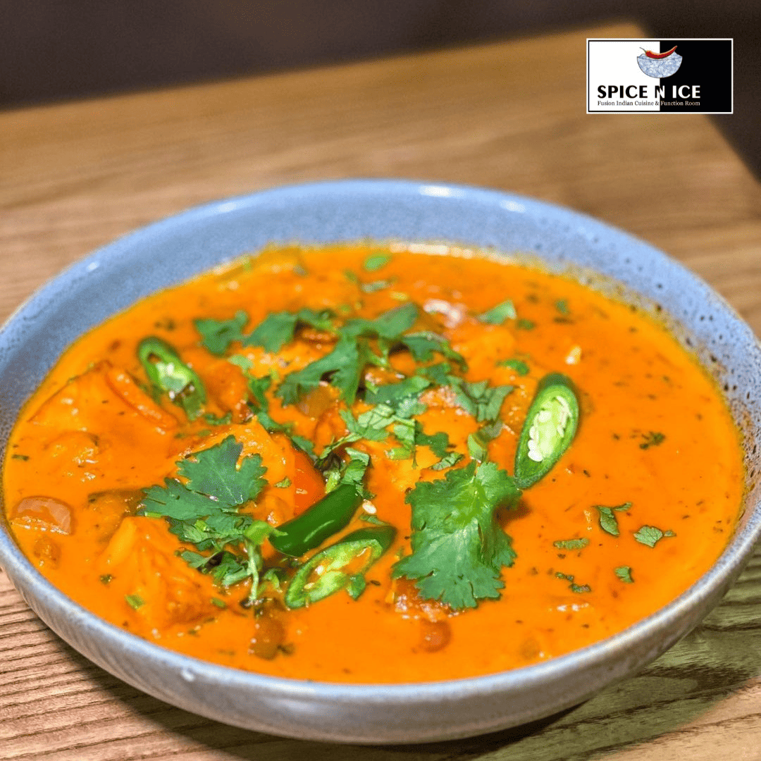 Paneer Butter Masala - rich, creamy Indian curry with cubes of paneer cheese in a spiced tomato and butter sauce.