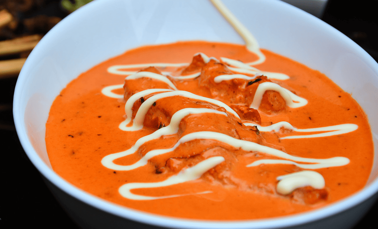 Delicious butter chicken dish served in a bowl.